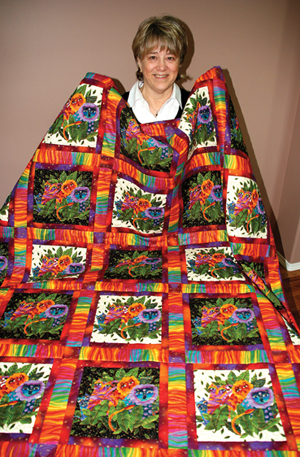 Carol Gerhart of Rose Garden Quilts and Fabrics designed this quilt, Cats Scanning the Jungle, as a fundraiser for the CAT Scan Campaign.